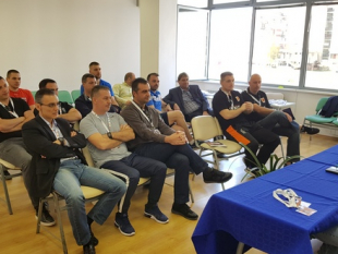 Coaches and referees meet before the Final Four