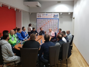 Coaches and referees meet before the Final Four